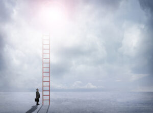 Businessman Looks Up At Red Ladder Extending Into The Cloudsdemonstrate the title: Vertical-Specific CLM Software Isn't Specific Enough for GovCon